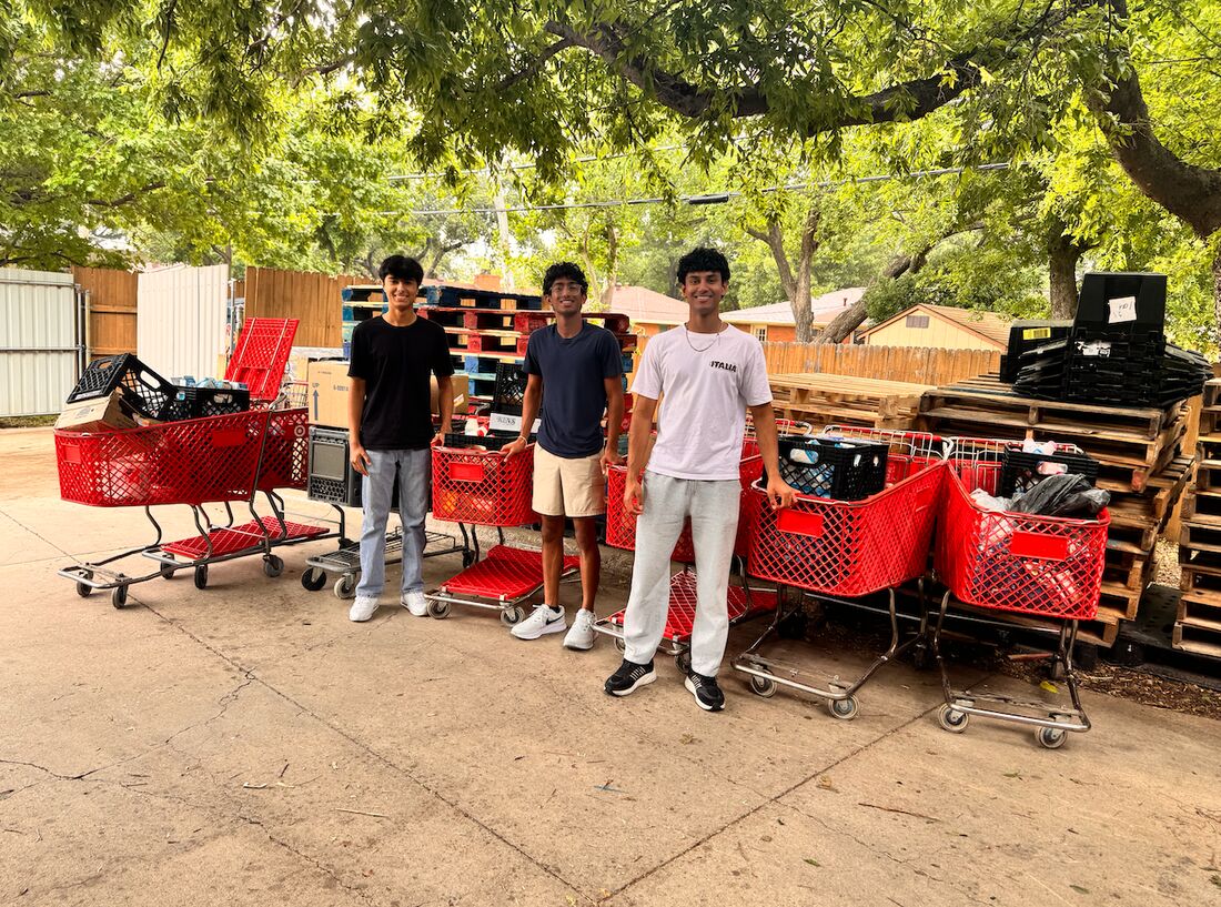 Volunteers collecting carts of donated food