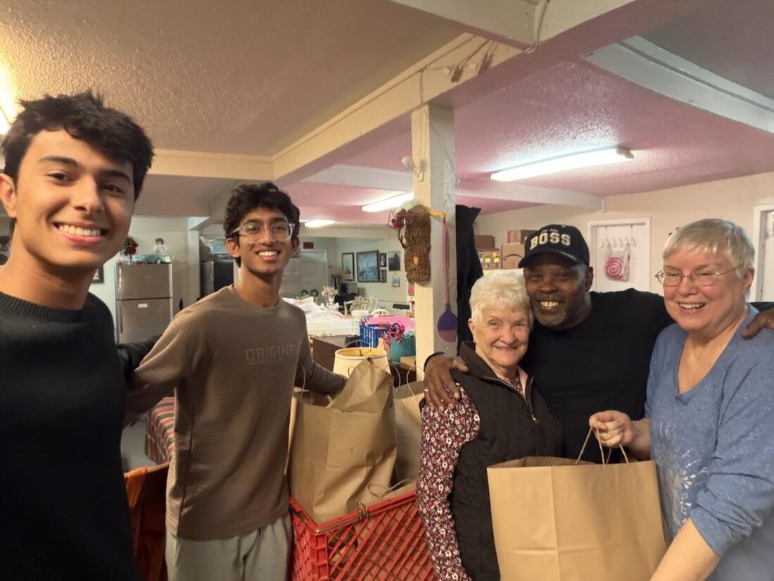 Volunteers delivering food donations to a community pantry